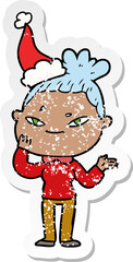 hand drawn distressed sticker cartoon of a woman wearing santa hat