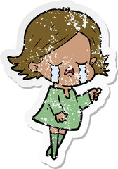 distressed sticker of a cartoon girl crying