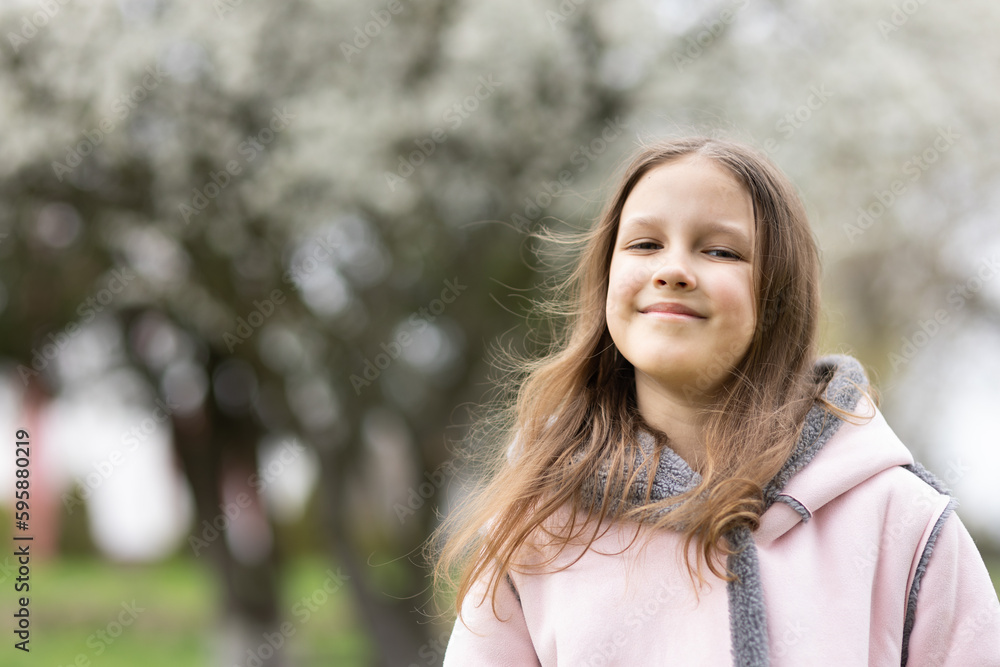 Poster a girl child  on a walk in the spring