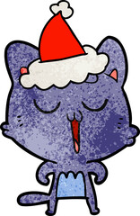 hand drawn textured cartoon of a cat singing wearing santa hat