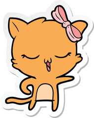 sticker of a cartoon cat with bow on head