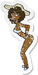 retro distressed sticker of a cartoon pin-up beach girl