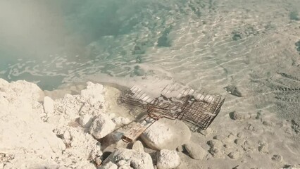 Boiled eggs in hot springs on the Kuril Islands. Water temperature 100 degrees Celsius