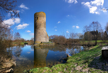 Medieval ruin of Baldenau castle with its tower and moat in early spring