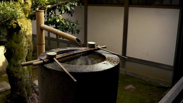 Relaxing Running Water in Traditional Japanese Buddhist Temple Grounds- Shishi Odoshi