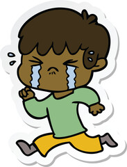 sticker of a cartoon boy crying