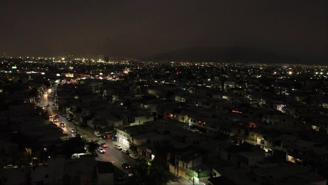 Peaceful city at night, illuminated buildings, moving cars, Monterrey Mexico