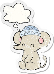 cartoon cute elephant with thought bubble as a distressed worn sticker
