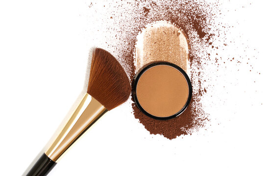 Crushed bronzing powder with makeup brush isolated on white background. Bronzer for face contouring or creating tanned look
