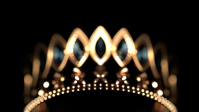 Golden crown with brilliants on black background flowing focus 3D 4K animation. Sparkling royal corona