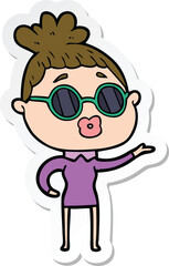 sticker of a cartoon woman wearing sunglasses
