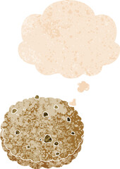cartoon biscuit with thought bubble in grunge distressed retro textured style