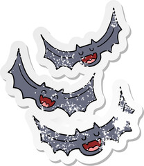 distressed sticker of a cartoon vampire bats