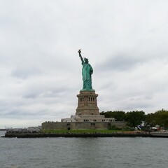 Panorama of the Statue of Liberty in autumn entourage, NYC