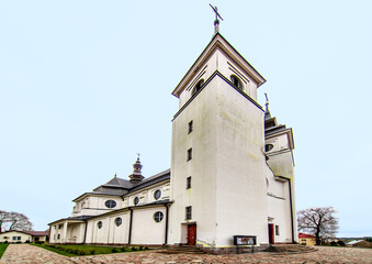 Fototapeta premium General view and architectural details of the baroque Roman Catholic church of St. Agnes built in 1924 in Goniadz, Podlasie, Poland.