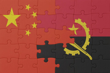 puzzle with the national flag of angola and china . macro.concept.