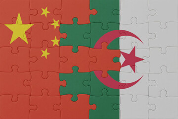 puzzle with the national flag of algeria and china . macro.concept.