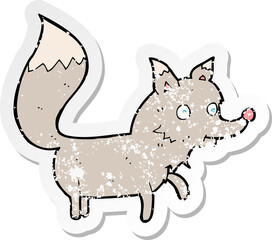 retro distressed sticker of a cartoon wolf cub