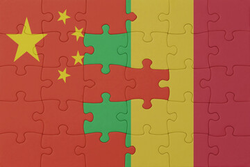 puzzle with the national flag of mali and china . macro.concept.
