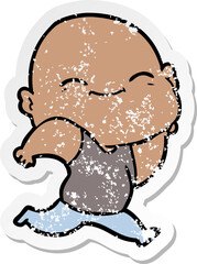 distressed sticker of a cartoon happy bald man