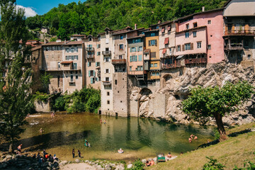 Fototapeta na wymiar The Pont-en-Royans village with its hanging houses and the blue waters of the Bourne river in the Vercors, mountains of the French Alps