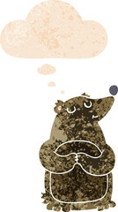 cartoon bear with thought bubble in grunge distressed retro textured style