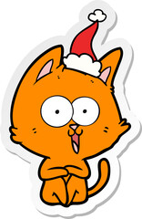 funny hand drawn sticker cartoon of a cat wearing santa hat