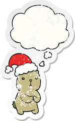 cartoon christmas bear worrying with thought bubble as a distressed worn sticker