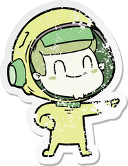 distressed sticker of a happy cartoon astronaut man