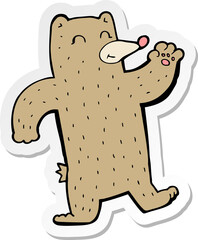 sticker of a cartoon waving bear