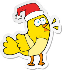 sticker of a cartoon bird wearing christmas hat