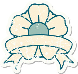 worn old sticker with banner of a flower