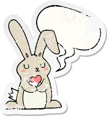 cartoon rabbit in love with speech bubble distressed distressed old sticker