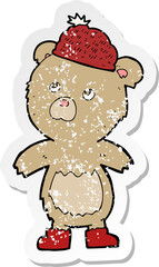 retro distressed sticker of a cartoon bear in hat