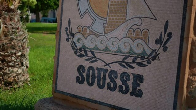 Close up street mosaic sign Sousse in the tourist area of the city. Coloured mosaics art creations in Tunisia.