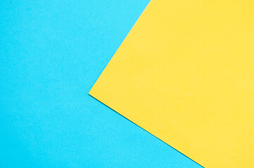 Yellow paper paper on a blue background. Place for text