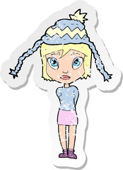 retro distressed sticker of a cartoon woman wearing winter hat