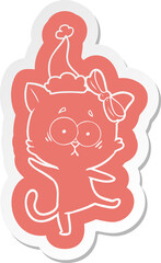 quirky cartoon  sticker of a cat wearing santa hat