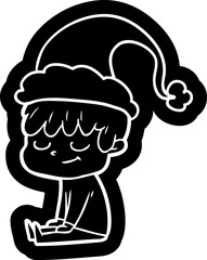 quirky cartoon icon of a happy boy wearing santa hat