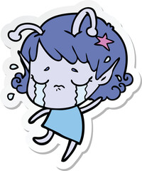 sticker of a cartoon crying alien girl