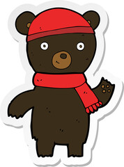 sticker of a cartoon waving black bear