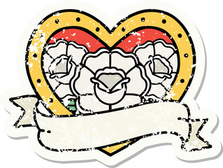 distressed sticker tattoo in traditional style of a heart and banner with flowers