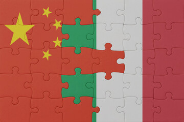 puzzle with the national flag of italy and china . macro.concept.