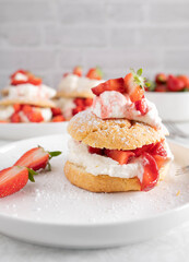 Mothers day pastry or cake with a delicious strawberry shortcake. Served on a white plate