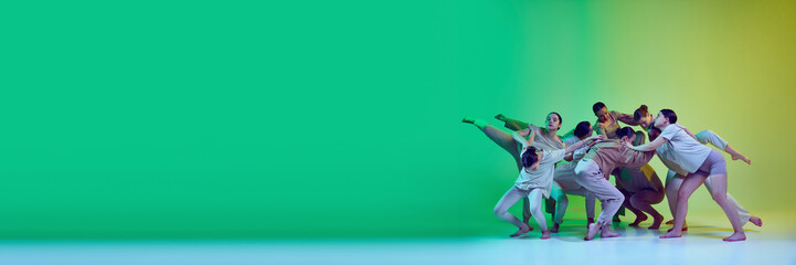 Banner with dance team of young adorable girls moving to the beat of the music on green gradient background in neon light. Copy space for ad, text