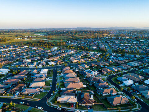 Drone image of last light of the day over suburb of Aberglasslyn in Hunter Valley showing houses