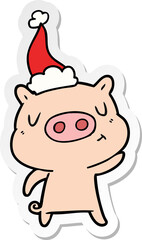 hand drawn sticker cartoon of a content pig wearing santa hat