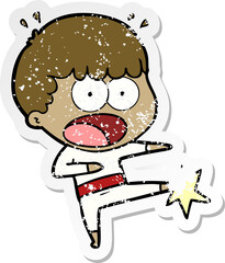 distressed sticker of a cartoon boy karate kicking