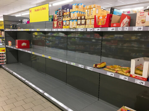 Empty Shelves in a Supermarket in Berlin due to people panicking and hoarding groceries in fear of the Corona Virus Outbreak. MARCH 2022