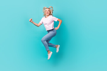 Fototapeta na wymiar Full length photo of cheerful good mood girl wear striped t-shirt hurry running at sale isolated on vivid turquoise color background